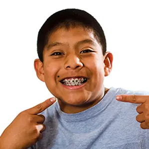 Child smiling with braces